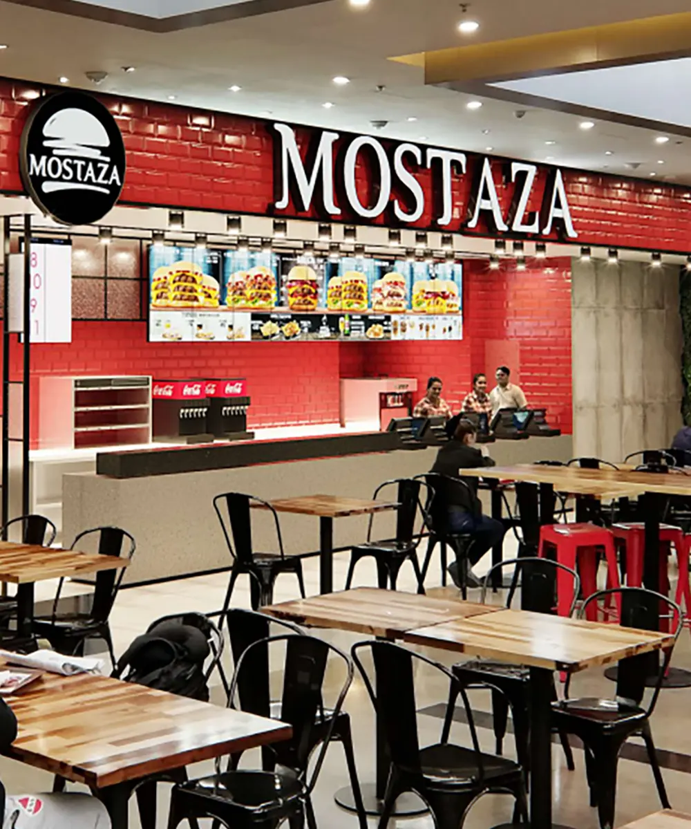 Foto referencial de Mostaza, de sus mesas y mostrador.